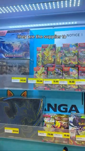 Sealed trading card products on the shelf at Kanga TCG